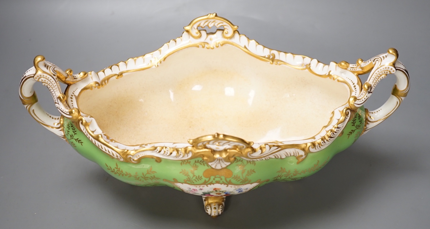 A Coalport twin handled boat shaped vase painted with a bird in panel on a lime green ground, c. 1900, 33cm